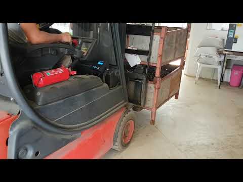 Forklift weighing a load on the forks — field video